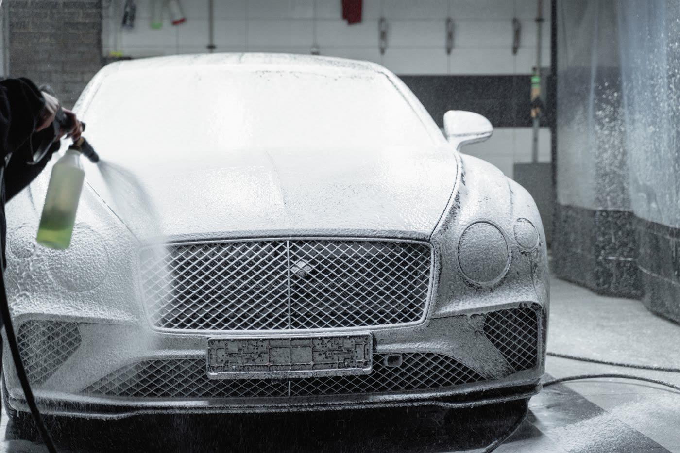 Example photo: foam wash on a luxury car