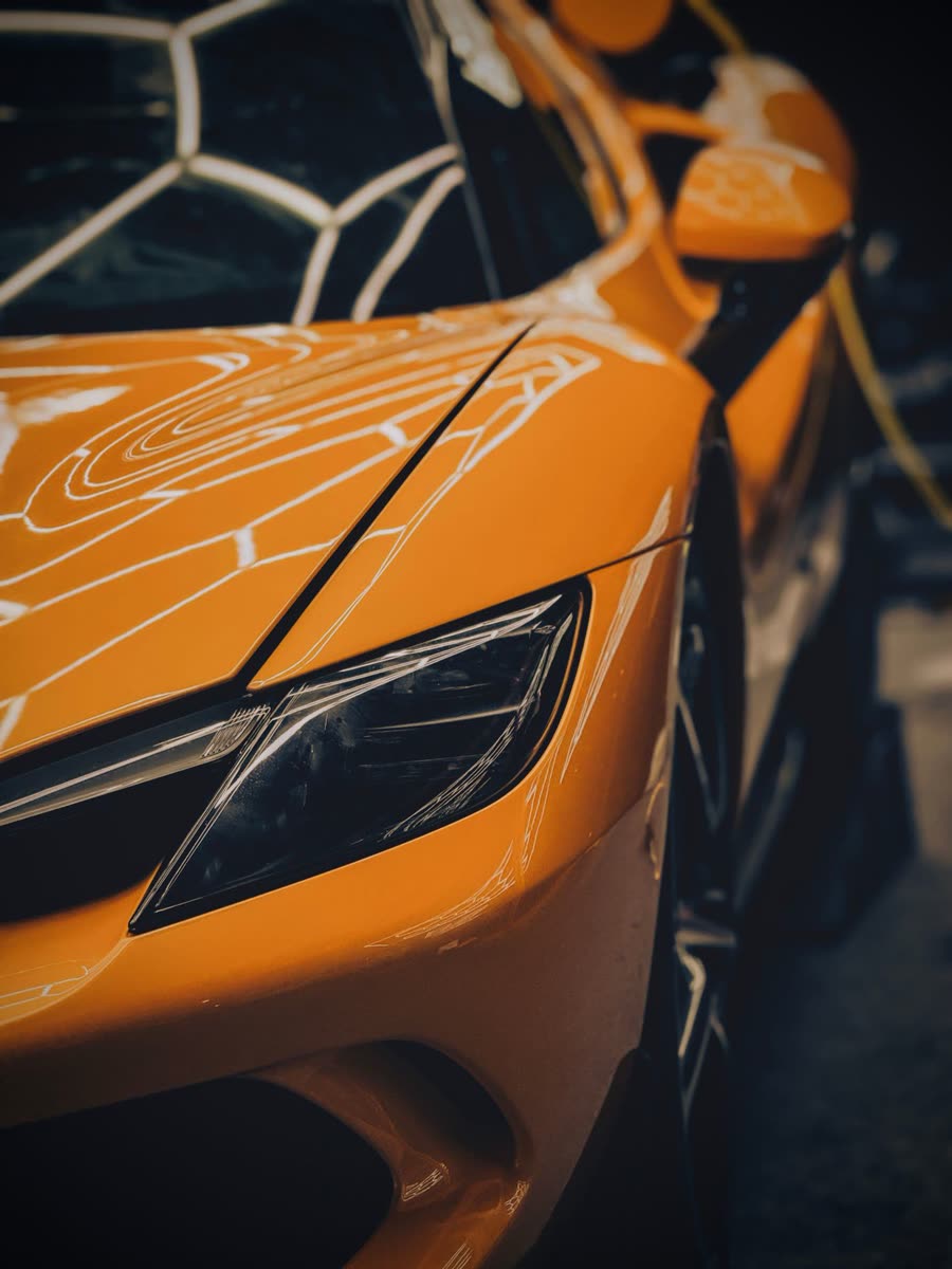 Example photo: glossy orange supercar